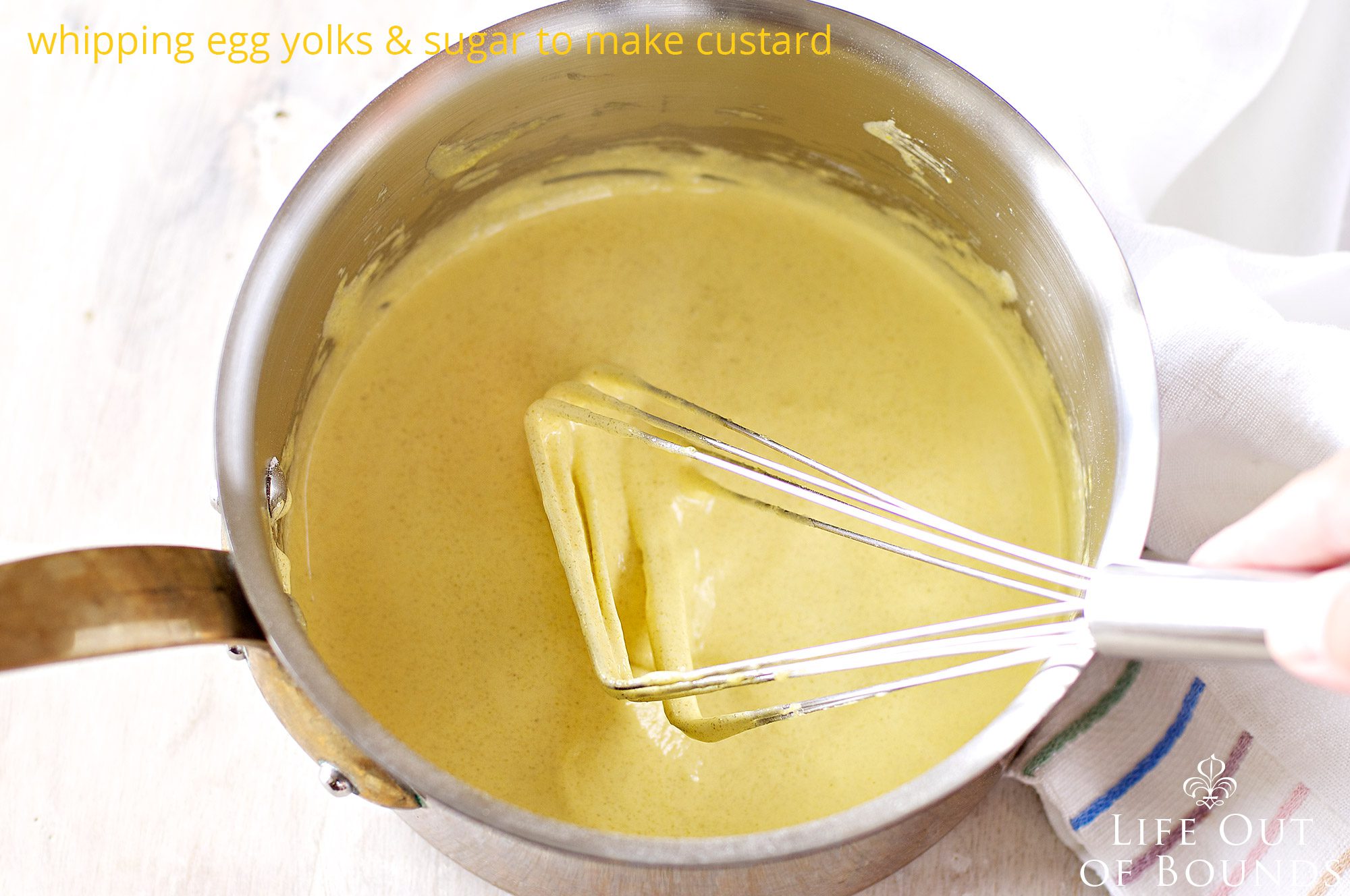 Whisking-egg-yolks-and-sugar-to-make-custard