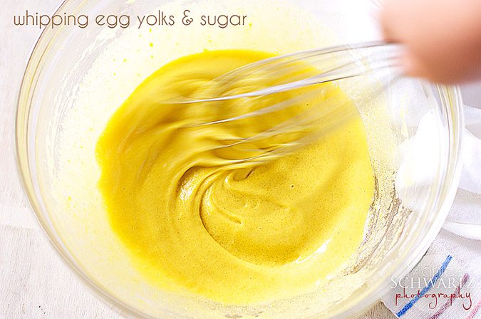Whipping-egg-yolks-and-sugar-to-make-tiramisu-dessert
