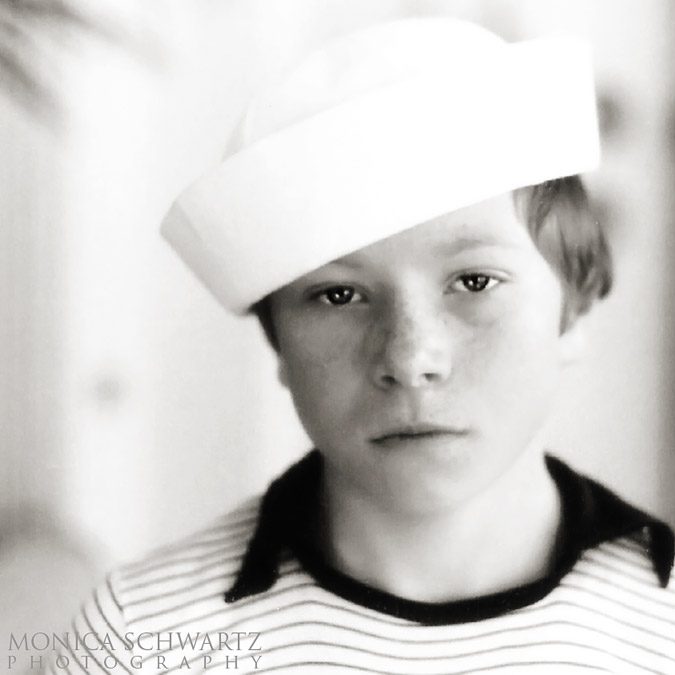 Black-and-white-portrait-of-a-boy-wearing-a-sailors-hat