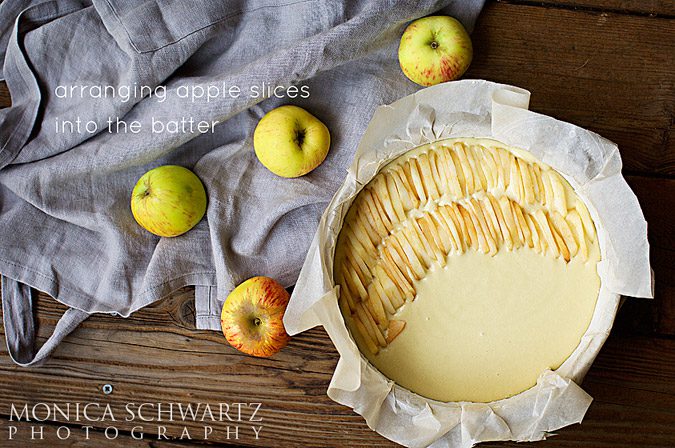 Arranging-apple-slices-in-the-batter-to-make-apple-cake