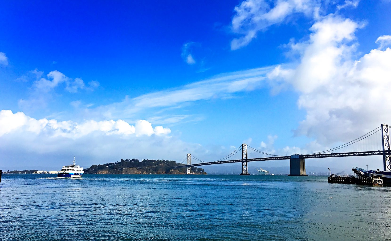 Looking-over-the-Bay-Bridge-from-the-Ferry-Building-San-Francisco