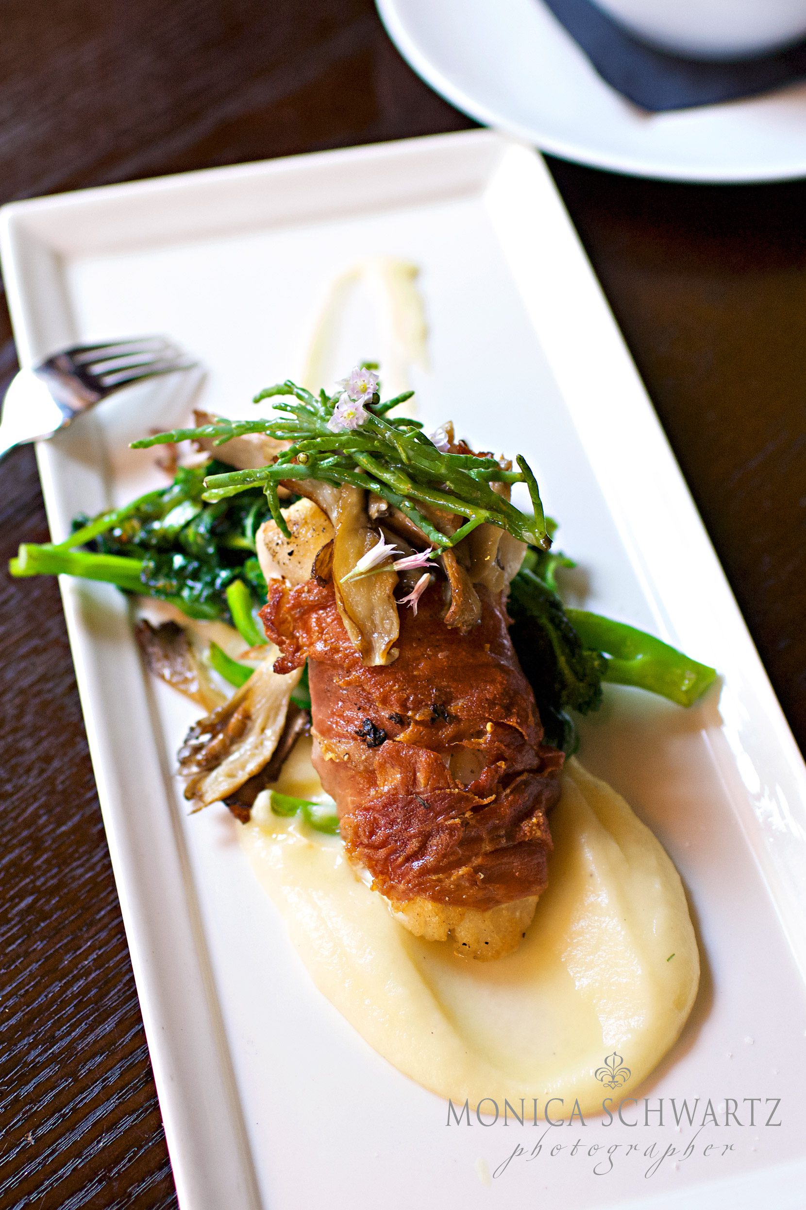 Prosciutto-wrapped-Cod-fillet-with-parsnip-puree-broccolini-and-trumpet-mushrooms-at-Basil-Restaurant-in-Carmel-by-the-Sea-California