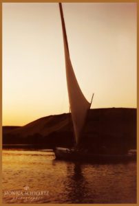 Sailing-in-a-felucca-at-sunset-on-the-Nile-river-Aswan-Egypt