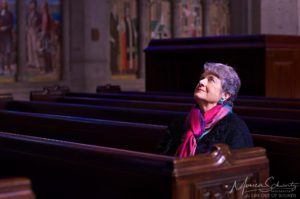Valerie-Carlson-enjoying-the-colors-of-Graced-by-the-Light-art-installation-at-Grace-Cathedral-in-San-Francisco-California