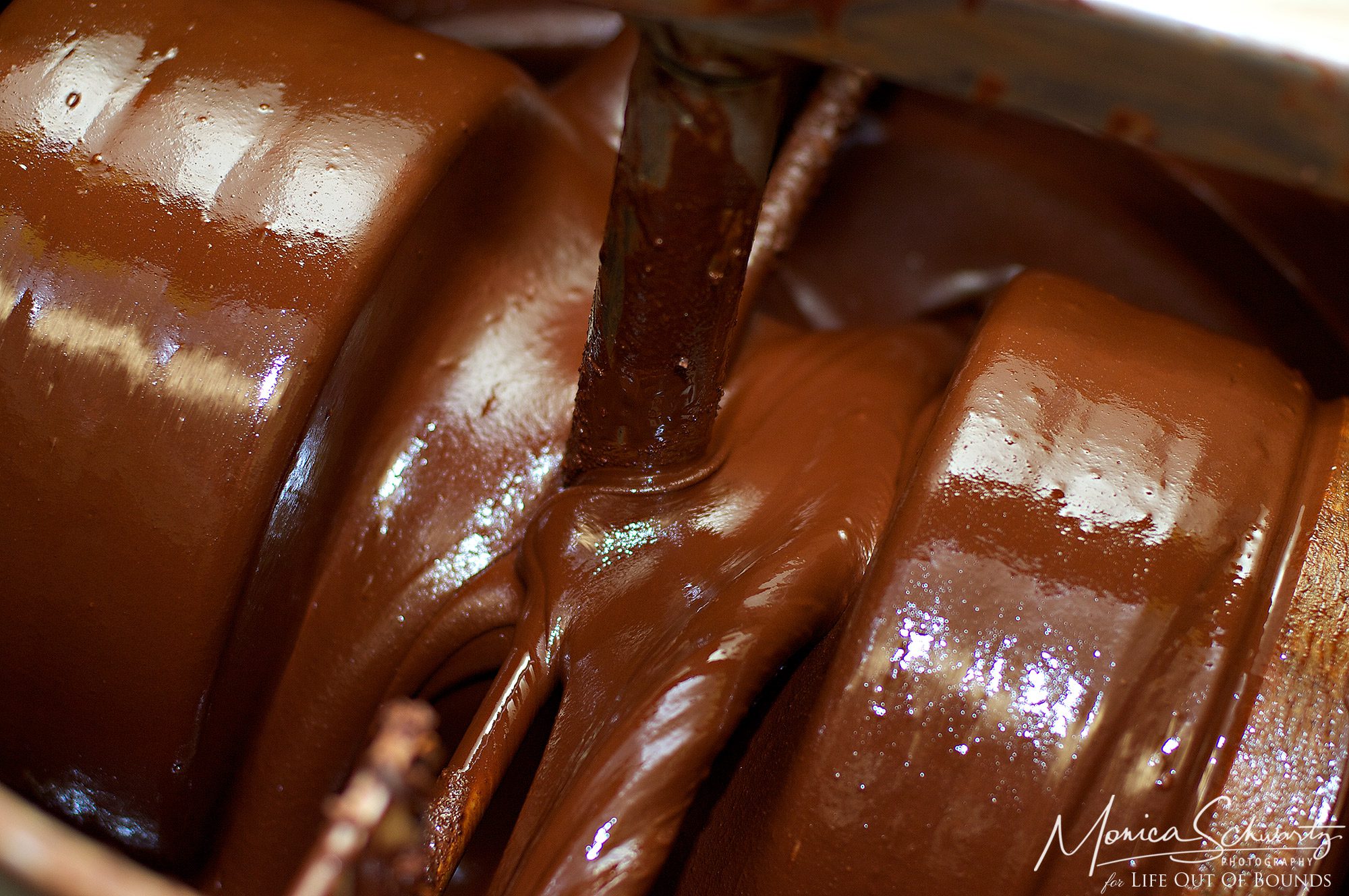 Churning-the-ingredients-to-blend-the-chocolate-at-Madre-Chocolate-Oahu-Hawaii