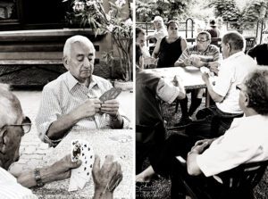Old-Italian-men-hanging-out-at-the-circolino-on-a-summer-afternoon-in-SantAmbrogio-Varese-Italy