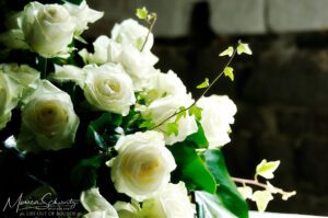 White-roses-left-by-the-bride-after-a-wedding-at-St-Peter-chapel-in-Porto-Venere-Italy