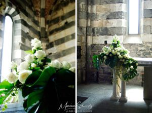 White-roses-left-by-the-bride-after-a-wedding-at-St-Peter-chapel-in-Porto-Venere-Italy