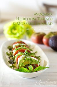 Caprese-salad-with-heirloom-tomatoes-mozzarella-avocado-and-fresh-basil-plus-balsamic-vinaigrette