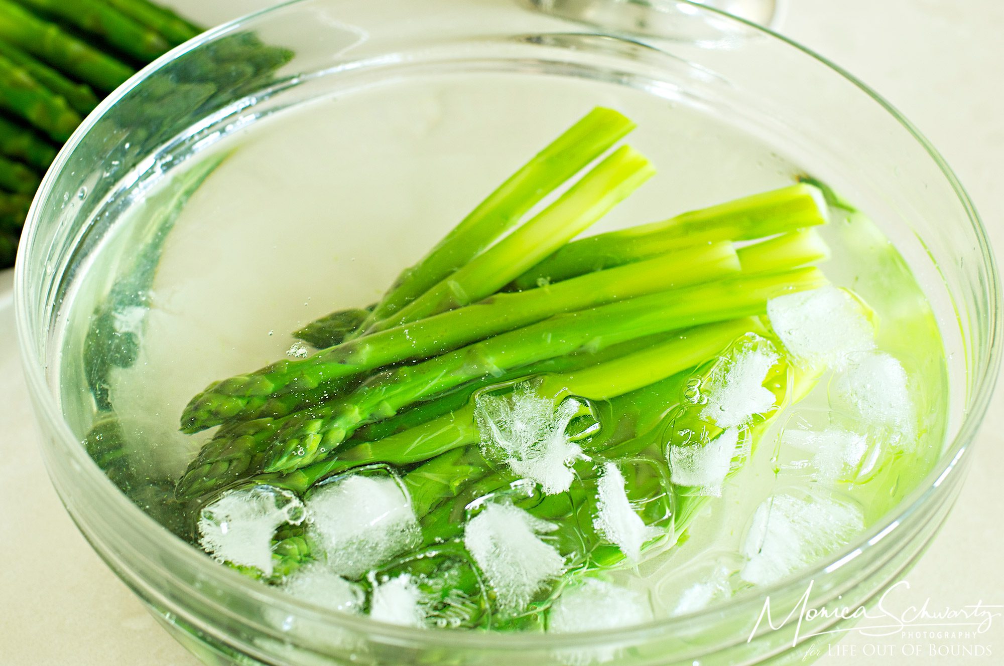 Blanched-asparagus-in-iced-water-bath-for-Asparagus-Mimosa-Salad-recipe
