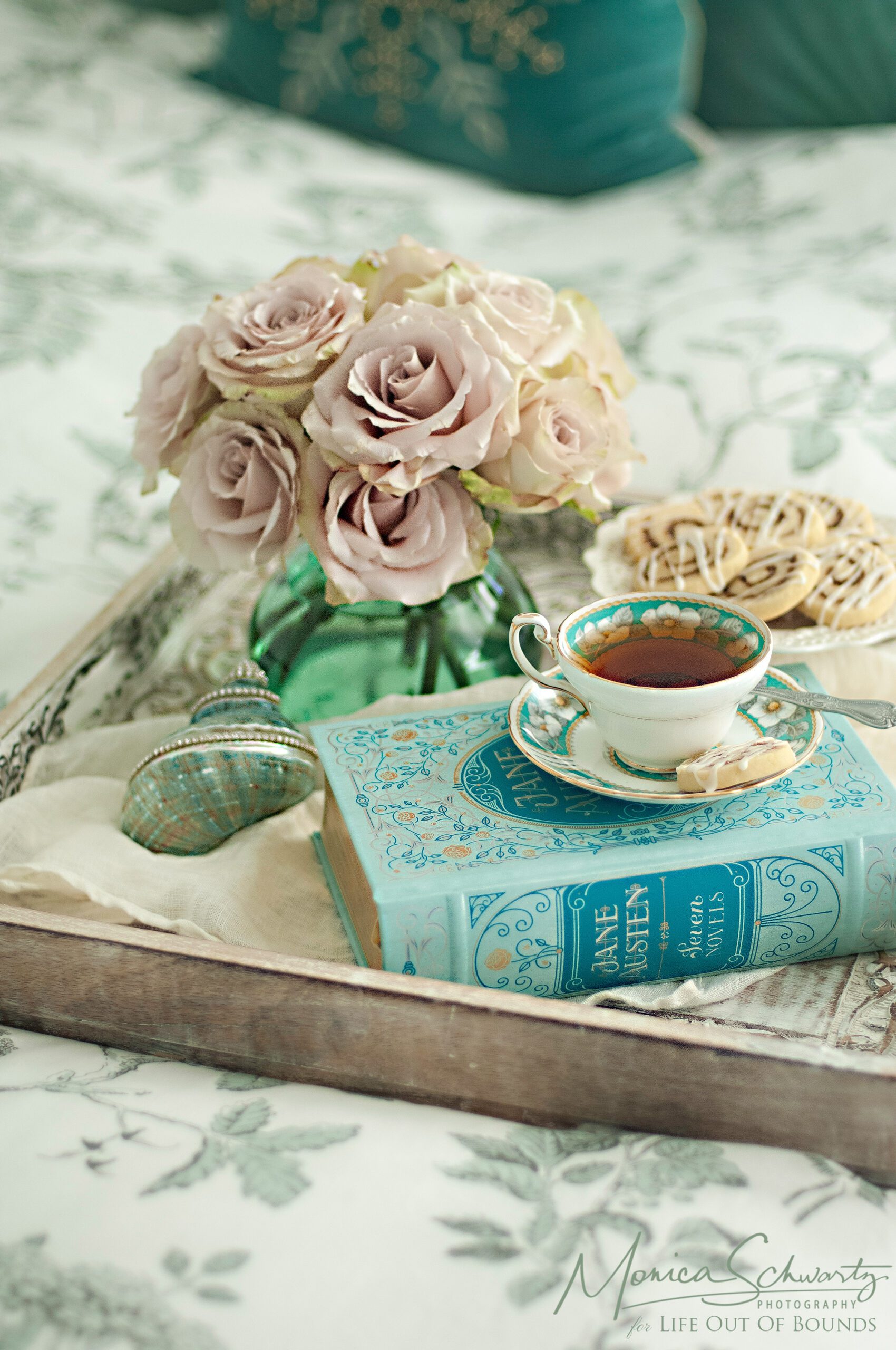 The-comfort-of-tea-and-cookies-with-a-good-book-and-flowers-still-life-photography