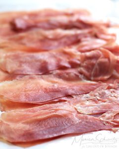 Perfectly sliced speck from Trentino, Italy