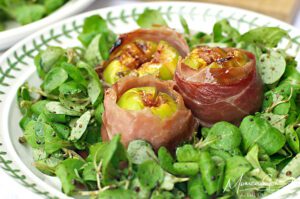 Speck-wrapped Grilled Figs on a bed of Maché salad dressed in Balsamic Vinaigrette
