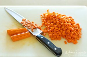 Chopping carrots to make soup