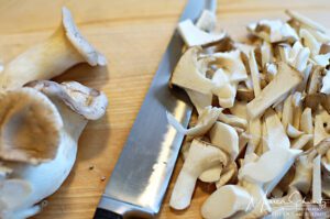 Sliced mushrooms to make Cannellini Bean Soup with Mushrooms, Sausage & Thyme | Recipe